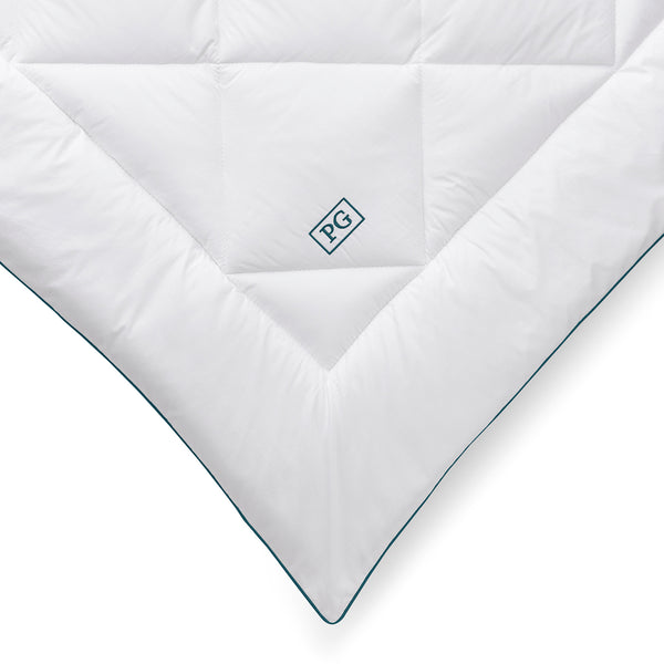 Close-up of the Pillow Guy Signature Down Alternative Mattress Pad showing diamond box quilting and soft cotton sateen fabric